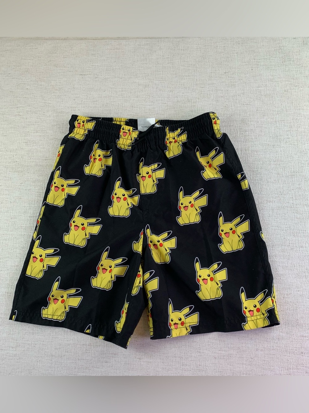 Pokemon boy's Pikachu Print swim trunks in black yellow size L(14-16)